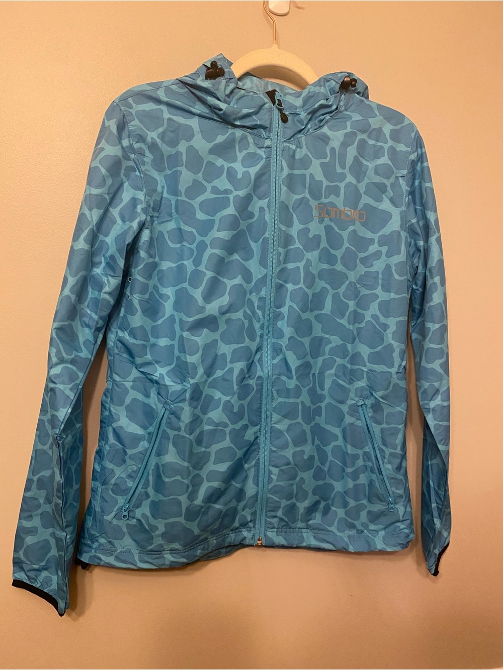 Light Blue Women's Hooded Raincoat with Subtle Spot Print